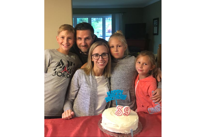 Beth-Ann Young of Deer Lake is seen with her family, from left, son Noah, husband Mike and daughters Olivia and Maggie. Young, 39, is battling cancer and is currently undergoing immunotherapy in Austria.
