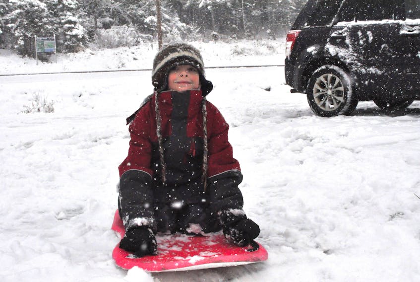 The snow is coming down on the west coast today and six-year-old Zachary French didn’t mind it one bit as he got in some sliding at Margaret Bowater Park in Corner Brook.