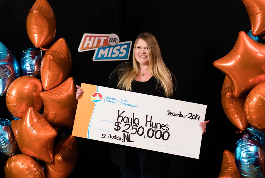 Kayla Hynes of St. Jude’s poses with a giant cheque for $250,000, her recent winnings in Atlantic Lottery’s Hit or Miss game. CONTRIBUTED BY ATLANTIC LOTTERY