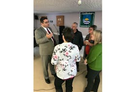 Tourism, Culture, Industry and Innovation Minister Bernard Davis talks with some people in Lark Harbour on Friday following the announcement that the south shore Bay of Islands town and neighboring Lark Harbour will get cell service.