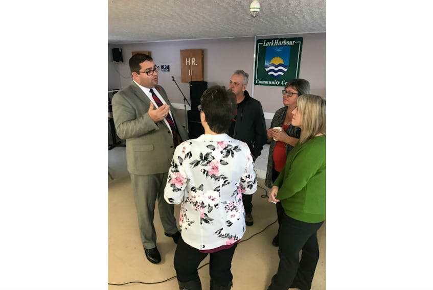 Tourism, Culture, Industry and Innovation Minister Bernard Davis talks with some people in Lark Harbour on Friday following the announcement that the south shore Bay of Islands town and neighboring Lark Harbour will get cell service.