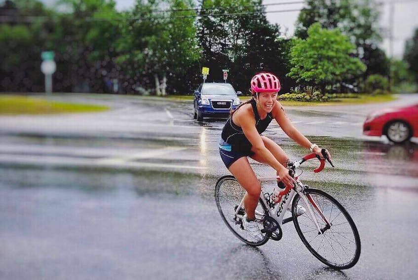 Megan Humphrey of Corner Brook makes her way through the wet streets of Pasadena during the 2019 Humber Valley Triathlon on Aug. 4. Humphrey came in fourth with a time of one hour, 20 minutes and 13.4 seconds in the female category of the triathlon event that was changed to a duathlon due to the weather conditions.