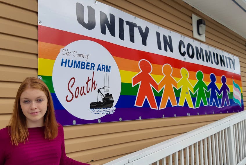 Isabella Pennell, one of the teen leaders with the Humber Arm South Youth Group, poses for a photo outside the community hall where many of the group’s activities take place.