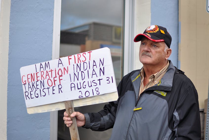 Joseph Gallant of South Branch holds a sign at a rally outside Long Range Mountains Liberal candidate Gudie Hutchings’ campaign headquarters in Corner Brook on Friday.