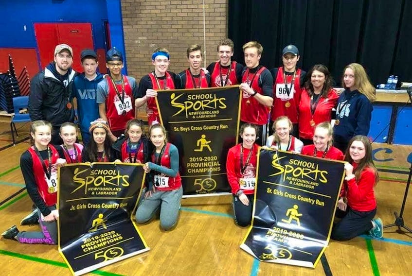 Stephenville runners took home three banners from the provincial cross-country running championships held in Marystown on Nov. 2. Displaying their banners are from left: (front) junior girls: Lydia Samms, Alyssa Ivany, Jewel Boland, Victoria Shea, Maria Shea; senior girls: Emma Dollimount, Abbi House, Danielle Duffy, Maddie Young; (back) Luke Burt, coach; Tristan Bullen and Brady Young, junior boys; senior boys: Colton Marche, Bradley Pinksen, Ben Philpott, Sam Parsons, Rosie Ryan, coach; and Amy Duffy, senior girls.