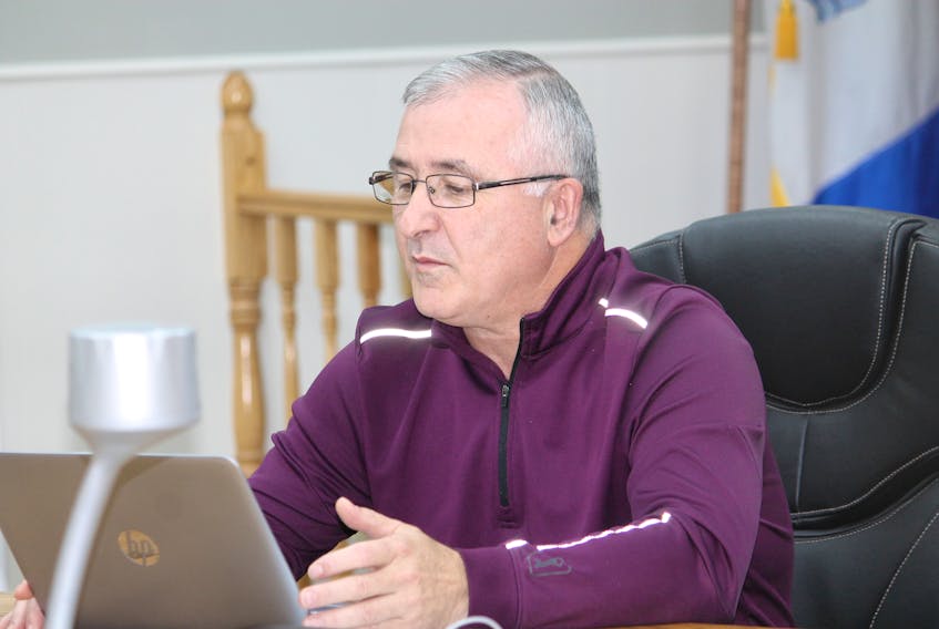 Coun. Mark Felix, chair of the Town of Stephenville’s finance committee, reads out a finance item from his laptop at Stephenville town council’s regular general meeting on Oct. 17. FRANK GALE/THE WESTERN STAR