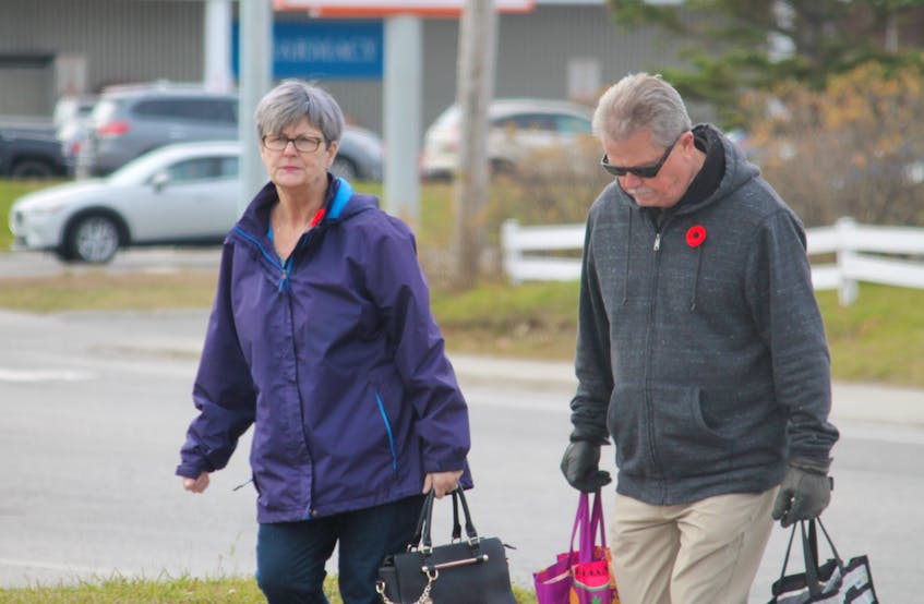 Walking into the Stephenville Plaza parking lot, Patricia and Gary Drake of Stephenville proudly wear their poppies. With Veteran's Week and Remembrance Day nearing, poppies are readily available at many locations throughout western Newfoundland. The Drakes say they cannot forget all veterans and Patricia has a special place in her heart her uncle, Sgt. Arthur O’Quinn, who died in the Second World War. FRANK GALE/THE WESTERN STAR