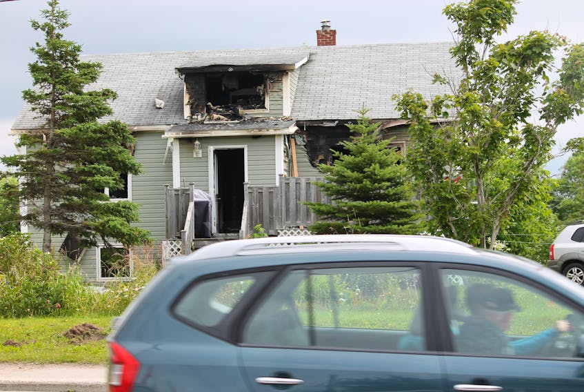 There was extensive fire, water and smoke damage to this home on Queen Street in Stephenville from an early morning fire on Saturday, Aug. 10. Occupants were able to escape the burning home. FRANK GALE/ THE WESTERN STAR