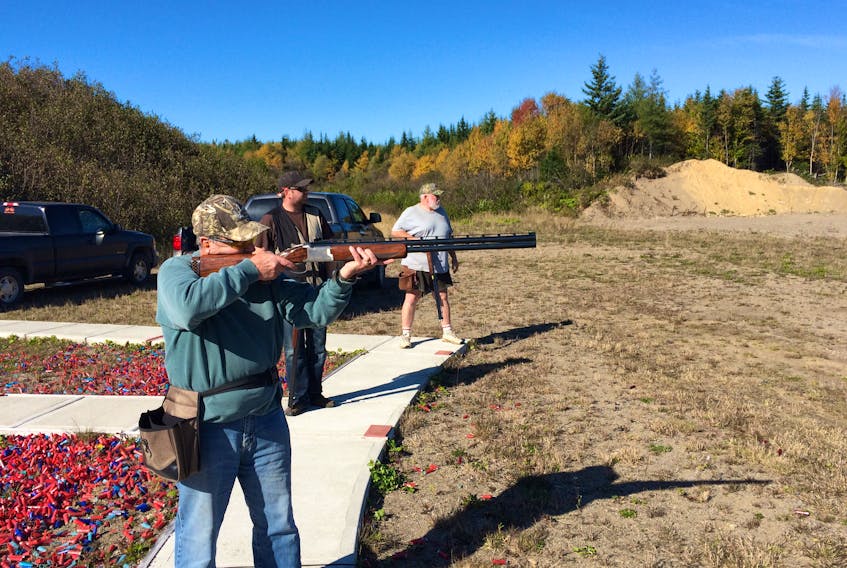 Max Fromm, a member of the Stephenville Shooting Club, practices skeet shooting at the existing range in this undated photo. Shane Dollimount, center; and Alan Skinner, also members, are seen in the background awaiting their turn to shoot.