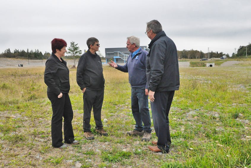 Representatives of the Southwest Coast SPCA talk with Tony Wakeham, right, MHA for Stephenville–Port au Port, about the new site for an animal shelter at Minnesota Drive in Stephenville, located between Acadian Village and College of the North Atlantic’s new Centre of Excellence. They include from left: Kim Blanchard, fundraising director; Ted White, president; and Tom O’Brien, building committee chairman. FRANK GALE/THE WESTERN STAR