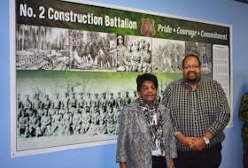 Annie Reddick, daughter of No. 2 Construction Battalion member Isaac (Ike) Desmond, had the honour of unveiling a display, which honours the battalion that’s been hung in the Construction Engineering Flight board room in Pictou. She is pictured here with Russell Grosse, executive director of the Black Cultural Centre.