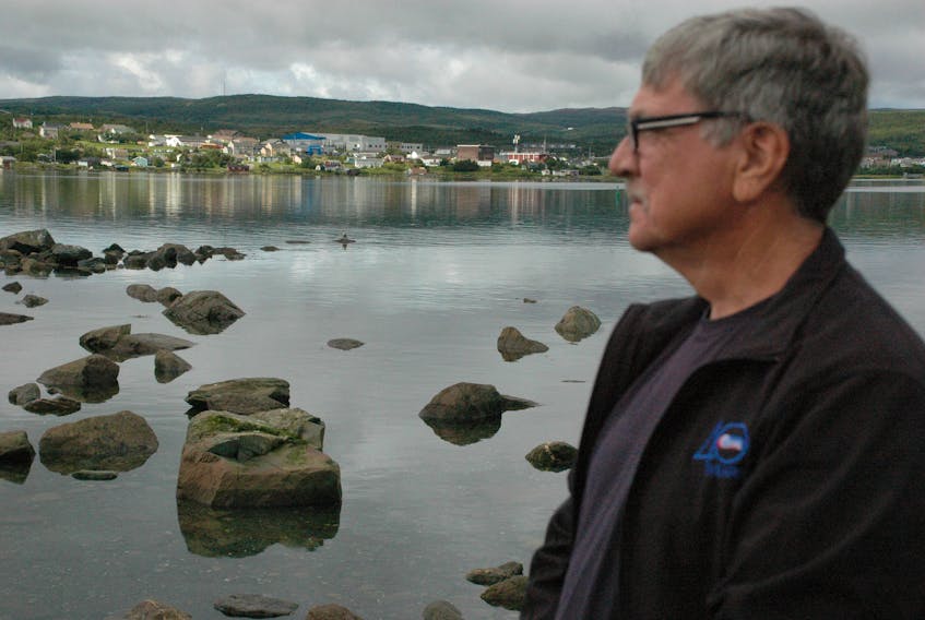 Ernest Simms gazes across the harbour at Murray’s Point. Simms is the chair of the St. Anthony Port Authority.