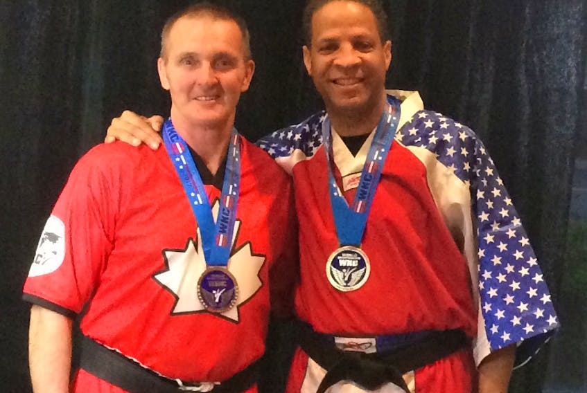 Silver-medal winner Camille Lavallee (left), of St. Barbe, with gold-medal winner Keith McKinley at the 2017 WKC World Championships in Orlando.