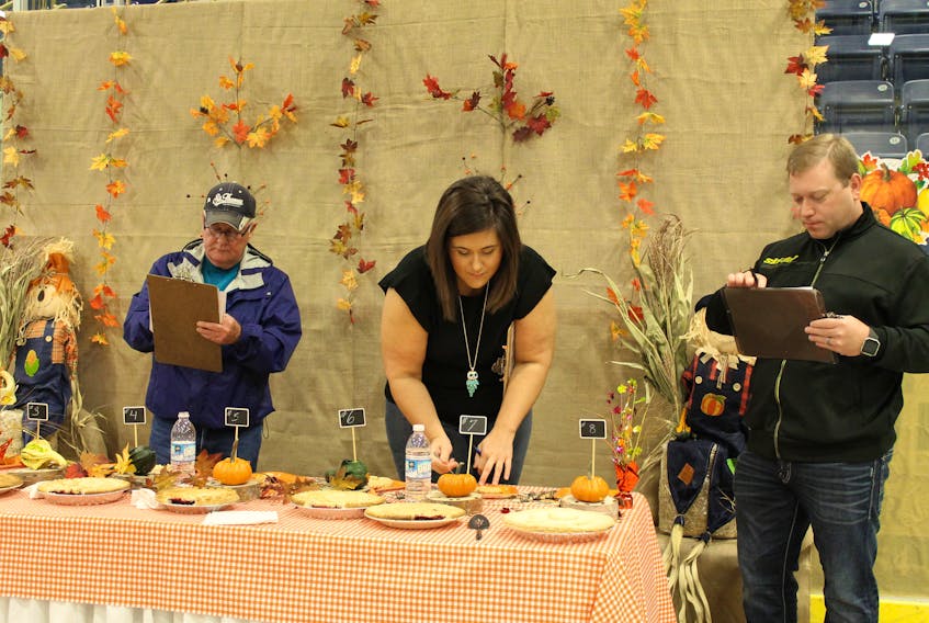 The St. Anthony Fall Fair and Trade Show wasn’t held this year, due to lack of interest. At last year’s event, Councillor Eric Boyd, Mayor Desmond McDonald and Deputy-Mayor Krista Howell, are seen hard at work judging the fair’s pie contest.