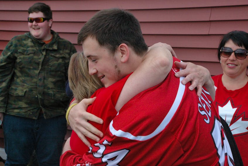 Nicholas Sexton hugged his grandmother Bridget Patey upon returning home from the Czech Republic. - Stephen Roberts