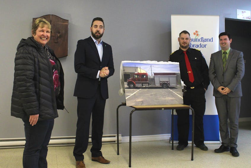 From left: St. Lunaire-Griquet Mayor Dale Colbourne, Municipal Affairs Minister Andrew Parsons, St. Lunaire-Griquet Fire Chief Tyler Hillier and Flower’s Cove-L’Anse aux Meadows MHA Christopher Mitchelmore announced a new fire truck for the town at the community centre on Thursday, Oct. 11.