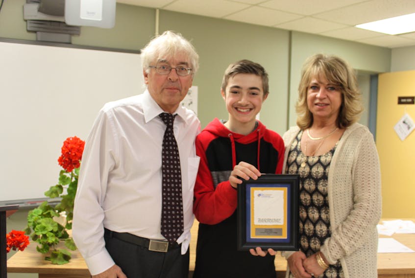 Brock White won second place for the western region in the Turning Points essay contest. Pictured (from left) Turning Points coordinator and judge Dr. Ross Elliott, second place recipient Brock White and Newfoundland and Labrador English School District program specialist Sherri Sheppard.