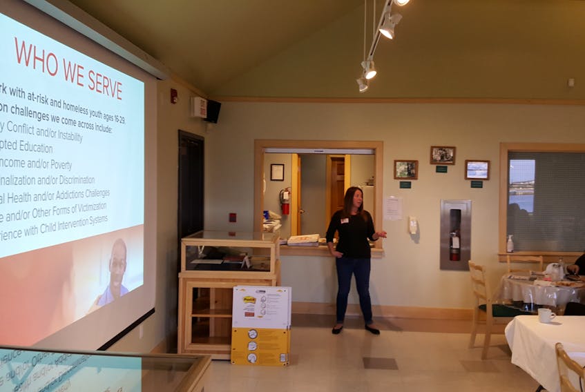 Jill Doyle, director of programs with Choices for Youth (CFY), speaks to attendees at a meeting in St. Anthony, Sept. 11, 2017. CFY staff toured across the province to address issues facing young people last year and published the “We Are Ready” report to reveal their results.