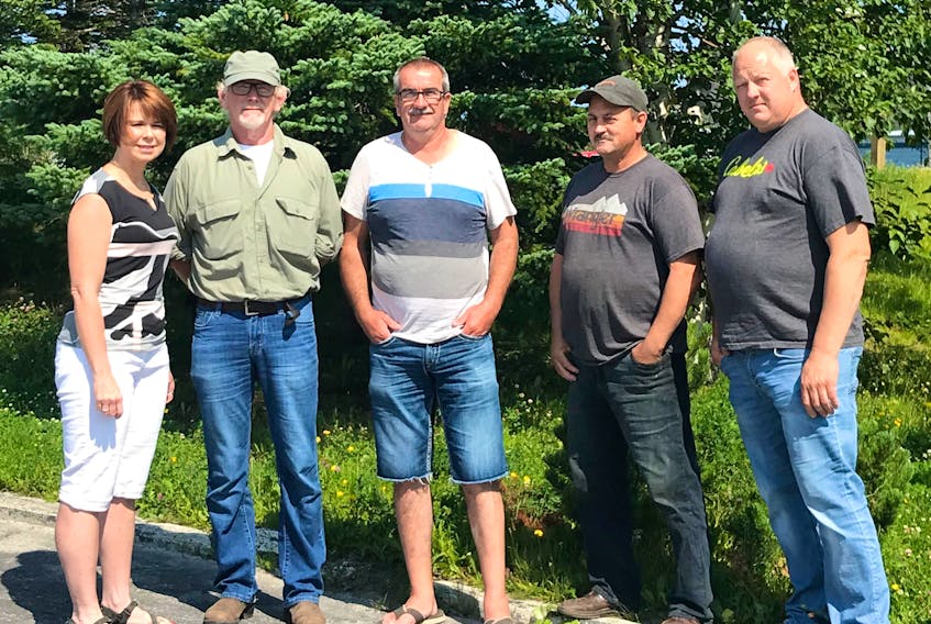 From left, Roddickton Mayor Sheila Fitzgerald, Main Brook sawmill owner Ed Coates and wood contractors Wally Gobbins, Keon Weir, Trevor Filliers and Randall Tatchell (not pictured) got together over the weekend to discuss the declining state of the forestry industry and are demanding answers from the provincial government on why there is yet to be a final decision on a pellet plant for the area.