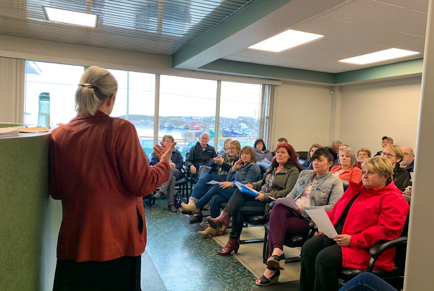Joanie Cranston, a physiotherapist, speaks to the public about opening a community clinic in Port au Choix during a meeting on May 28.