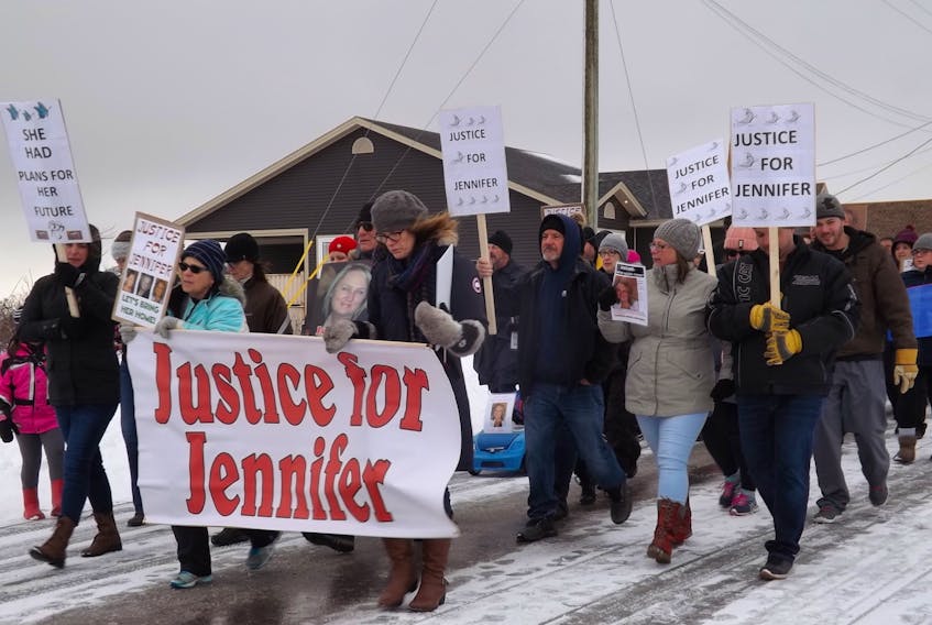 People marched through Husky Drive, where Jennifer Hillier-Penney went missing on Nov. 30, 2016, to demand justice for the missing woman.