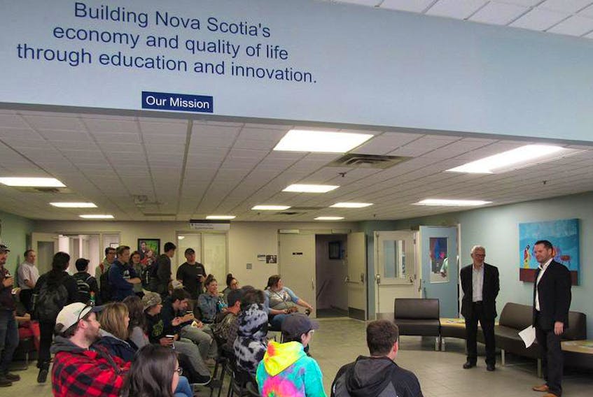 Energy and Mines Minister Derek Mombourquette and Tom Gunn, principal of the Strait Area Campus of the Nova Scotia Community College, are shown during a Solar Electricity for Community Buildings announcement Monday in Port Hawkesbury