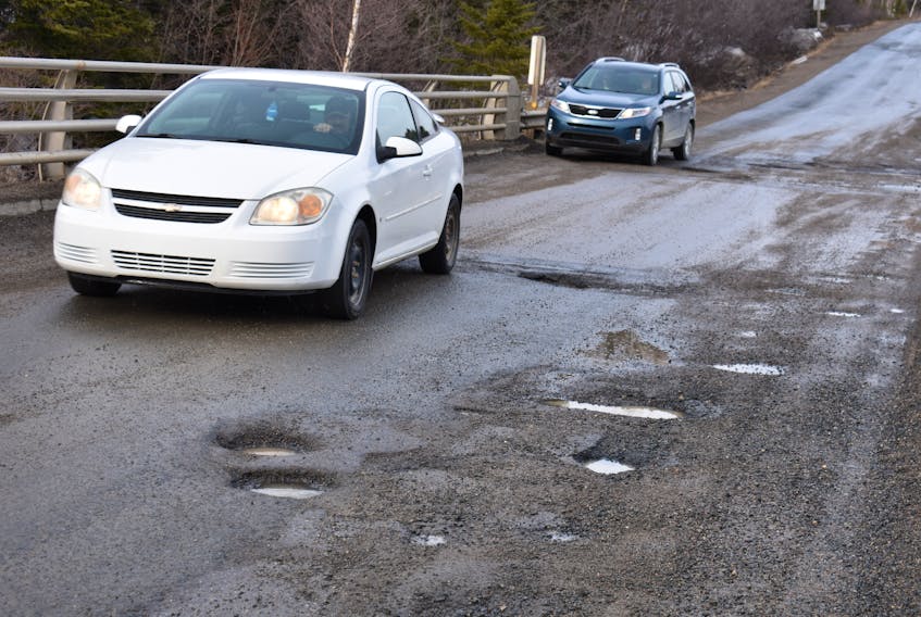 Motorists have to go through great lengths to manoeuver areas of potholes.