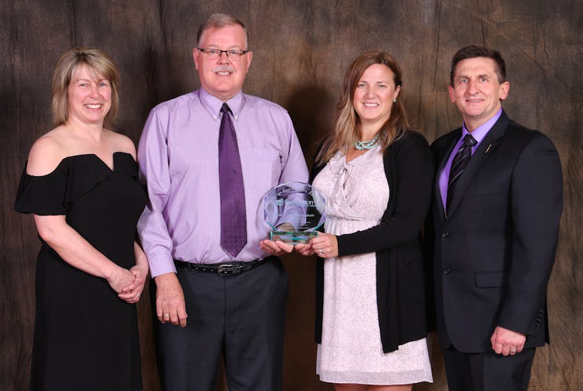The Town of Springdale recently received Recreation Newfoundland and Labrador’s Active Communities Award. Pictured are, from left, Tina Auchinleck-Ryan, Recreation Newfoundland and Labrador president; Springdale Deputy Mayor Shawn Weir; Shauna Hewlett, director of Recreation, Tourism and Heritage for Springdale; and Derek Bennett, parliamentary secretary to the minister of Children, Seniors and Social Development.