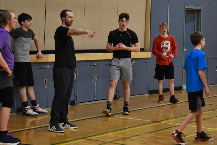 Coach John Kirby, pointing, directs his basketball team during a recent practice. Copper Ridge Academy will compete in the Baie Verte Invitational this weekend.