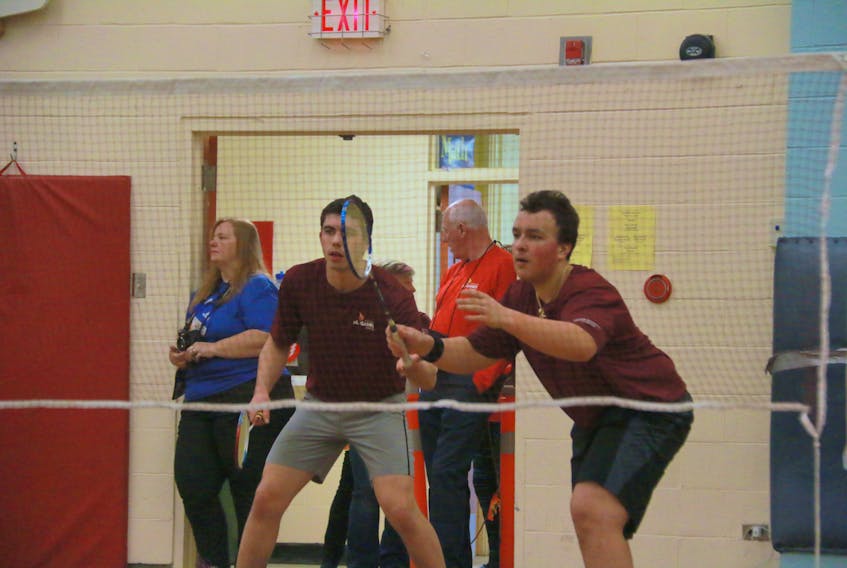 Dorset Collegiate students Benjamin Tizzard, left, and Ty Winsor teamed up in doubles badminton and helped Team Central win a team gold medal at the Winter Games.