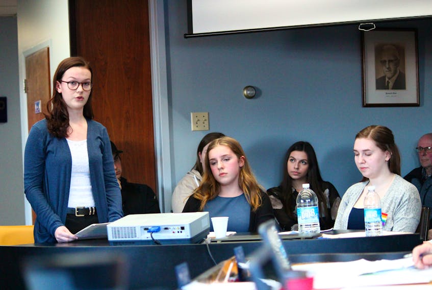 Members of the Gender Sexuality Alliance (GSA) at Indian River High, from left, Megan Paddock, Maria Lawlor, and Claudia Lilly, address members of the Springdale council tonight (April 23).
