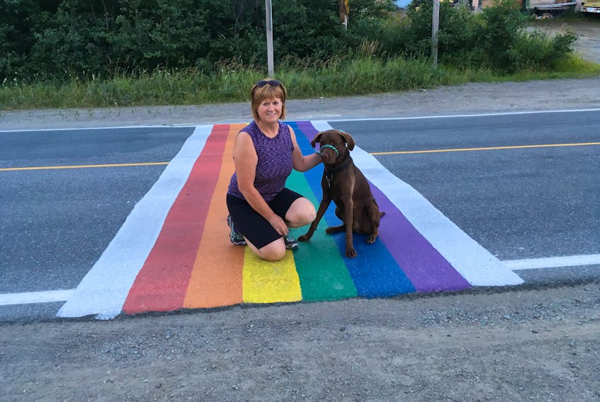 Betty Downey posing on the rainbow crosswalk in Baie Verte in 2016.