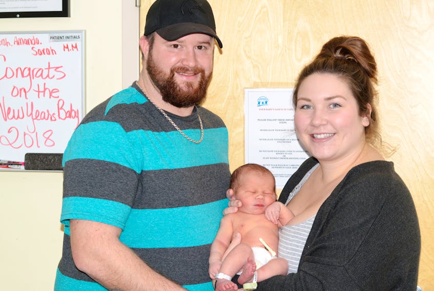 First-time parents, Meaghan Moore and Mike Mills, hold Angus Mills, the first baby born in Cumberland County in 2018. Angus was born early Thursday morning at the Cumberland Regional Health Care Centre.