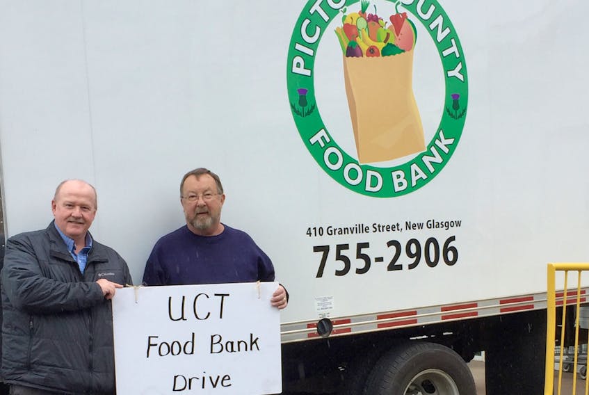 Tim Hingley of the United Commercial Travellers, left, and Ray Haines, manager of Pictou County Food Bank (East), are ready to accept donations to the food bank Thursday from 10 a.m. to 6 p.m. at various locations in the county. The local food bank needs help restocking its shelves since donations tend to be low in the spring and summer months.