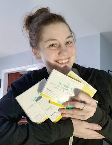 Nicole Turple holds a four-month supply of Symdeko, a medication for cystic fibrosis, that was gifted to her by Mark and Kelly Lindsay on Monday, March 2, 2020. The Lindsays gave Turple the medication after their 23-year-old daughter Chantelle passed away from the genetic disorder on Feb. 19, 2020.