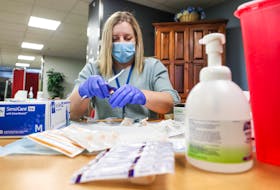 Northwood staff nurse Amanda Parsons prepares doses of the Moderna COVID-19 vaccine for long-term care residents at Northwood’s Halifax campus on Monday, Jan. 11, 2021.