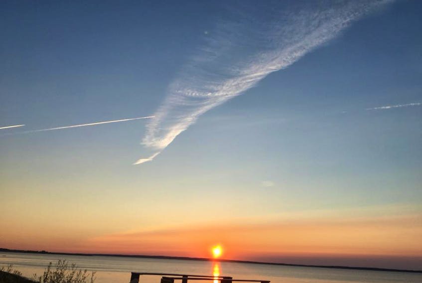 "Priceless."  That's what Jon Curry had to say about this stunning sunset along Nova Scotia's Brule Shore. The well-defined condensation trails that crisscrossed the late-day sky are a lovely bonus. Thank you for sharing that beautiful moment, Jon.