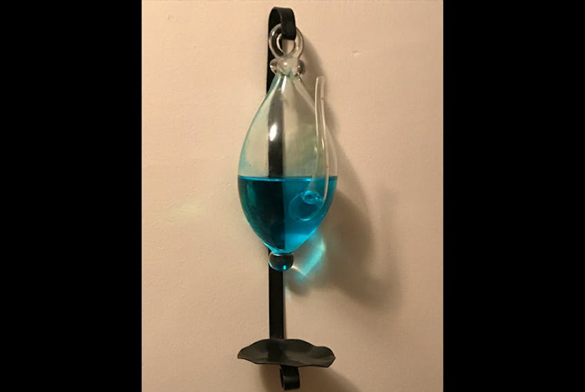 This is my glass barometer; I've had it for more than 20 years now. When Hurricane Juan made landfall near Halifax N.S., there was blue water on my floor!