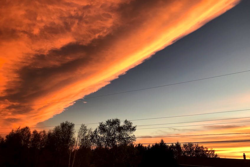 Hello Cindy. Here are 2 pictures of an amazing skyline we were fortunate to enjoy in Brookside on Friday evening October 2nd.  It seemed like a new system moving in but the weather didn't change very much.  Just wondering? - Bev Crouse