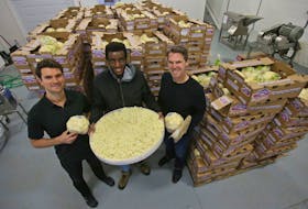 Outcast Foods chief marketing officer TJ Galiardi, employee Gary Chelsea and CEO Darren Burke are seen with trays of cauliflower, otherwise destined for the landfill, which the the company upcycles. Outcast takes the surplus of fruit and vegetables and turn them into high value, long shelf life, whole-plant powders. TIM KROCHAK/ The Chronicle Herald