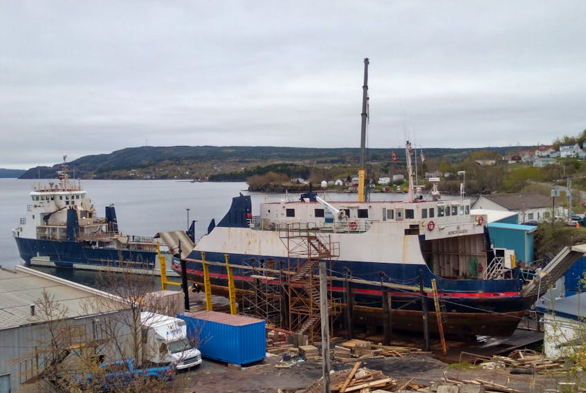 The Norton Galatea being pulled in for dry dock, as the M.V. Gallipoli is shown in the background, still in Clarenville after the province made a decision to cancel the contract and move the work to St. John’s.