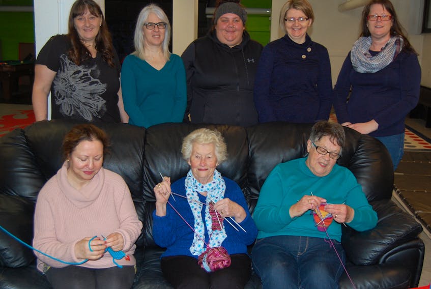 Some members of the ProcrastiKNITTERS group.