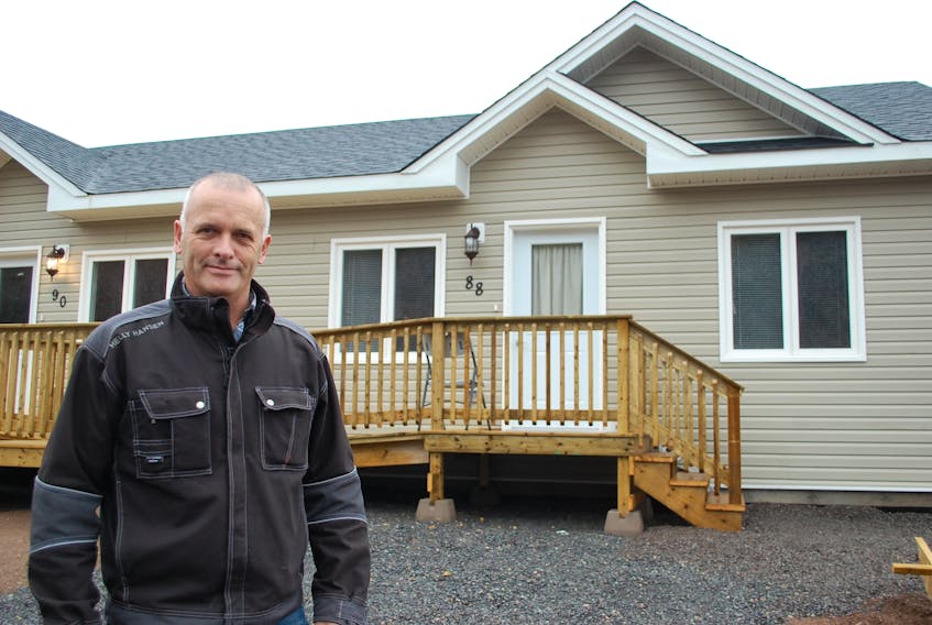 Pastor David Bowering of the New Life Community Church in front of one its housing units in Clarenville. The first tenant recently moved into the affordable housing project spearheaded by the church.
