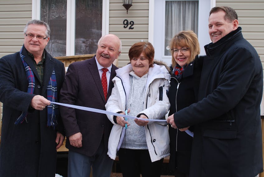 From left, New Life Church pastor Albert Trask, MP Churence Rogers, tenant Angela Bursey, MHA Lisa Dempster and MHA Colin Holloway at the official opening of the New Life Community Church Housing project in Clarenville on Monday.