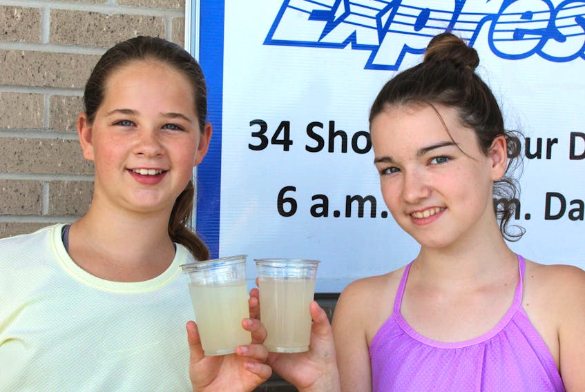Leah Wiseman,11, and Taylor Giles,12, outside Clarenville Area Co-Op selling lemonade for Nevaeh’s Lemonade Stand.