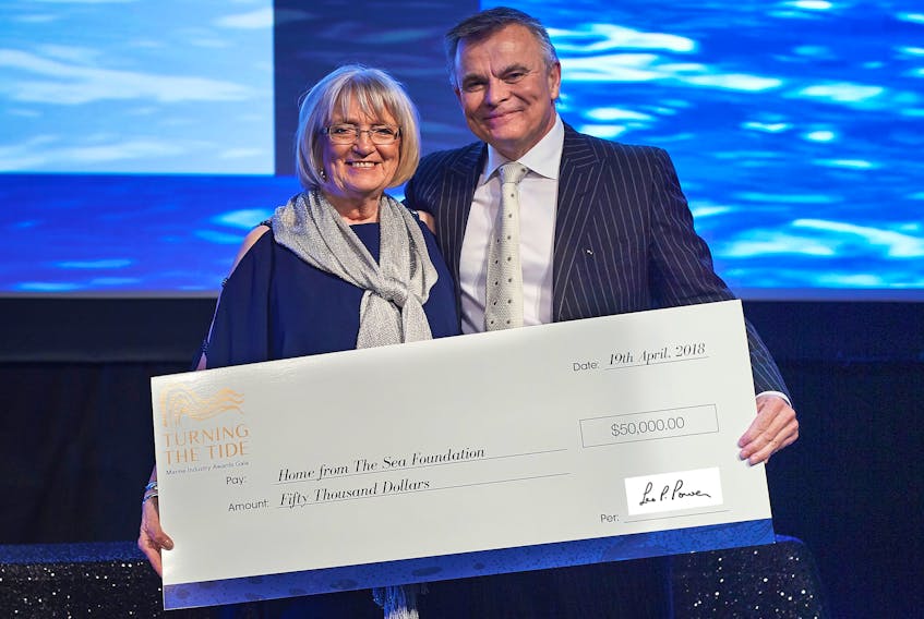 Leo Power presents the cheque for $50,000 to Myrtle Stagg of the Home from the Sea Foundation. Photo courtesy of Pilot Communications.