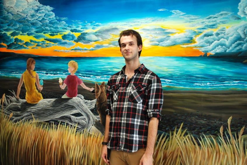 Kyle Best and his mural at Scoops in Clarenville.