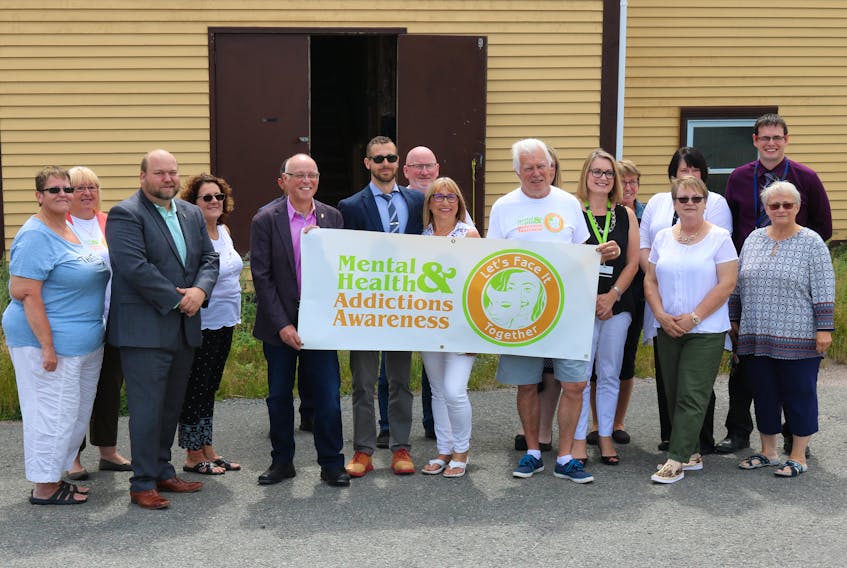 Bonavista MHA Neil King and Minister of Health and Community Services John Haggie joined members of Tip-A-Vista Wellness Foundation for a photo.