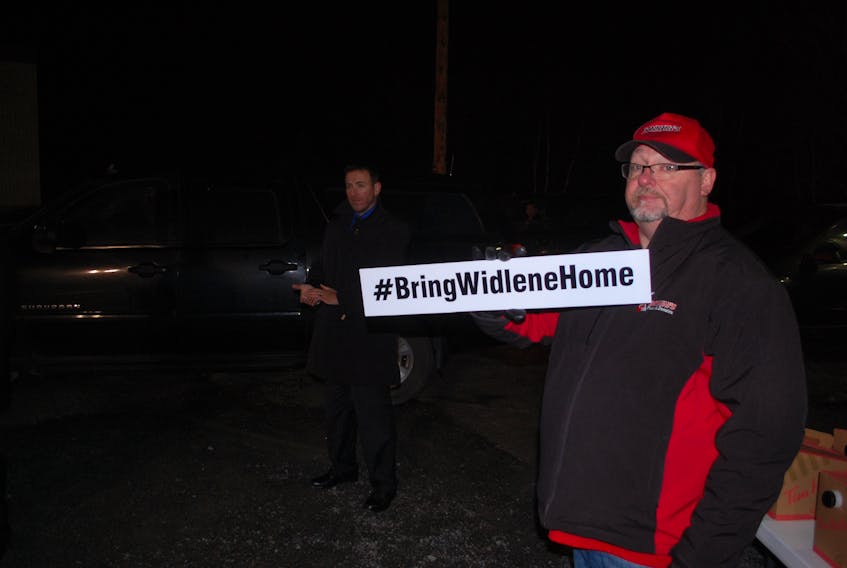 Shawn Hart brought along a sign reading #BringWidleneHome, hoping to draw the attention of the Prime Minister.