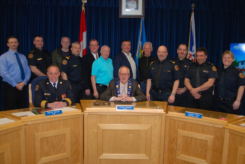 Clarenville council, CAO David Harris, fire chief Cory Feltham, former fire chief Bruce Strong and the local volunteer fire department at the announcement of the tender results for a new fire hall in the community.
